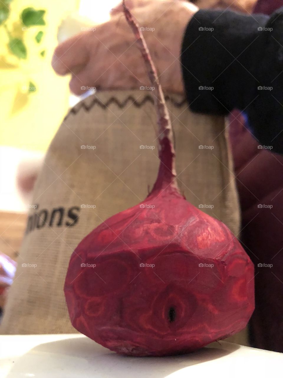 Beetroot and the hand that carefully peeled it