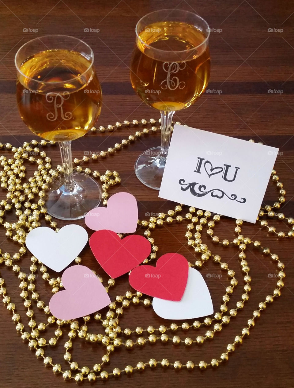 Wine glasses with gold beads and hearts