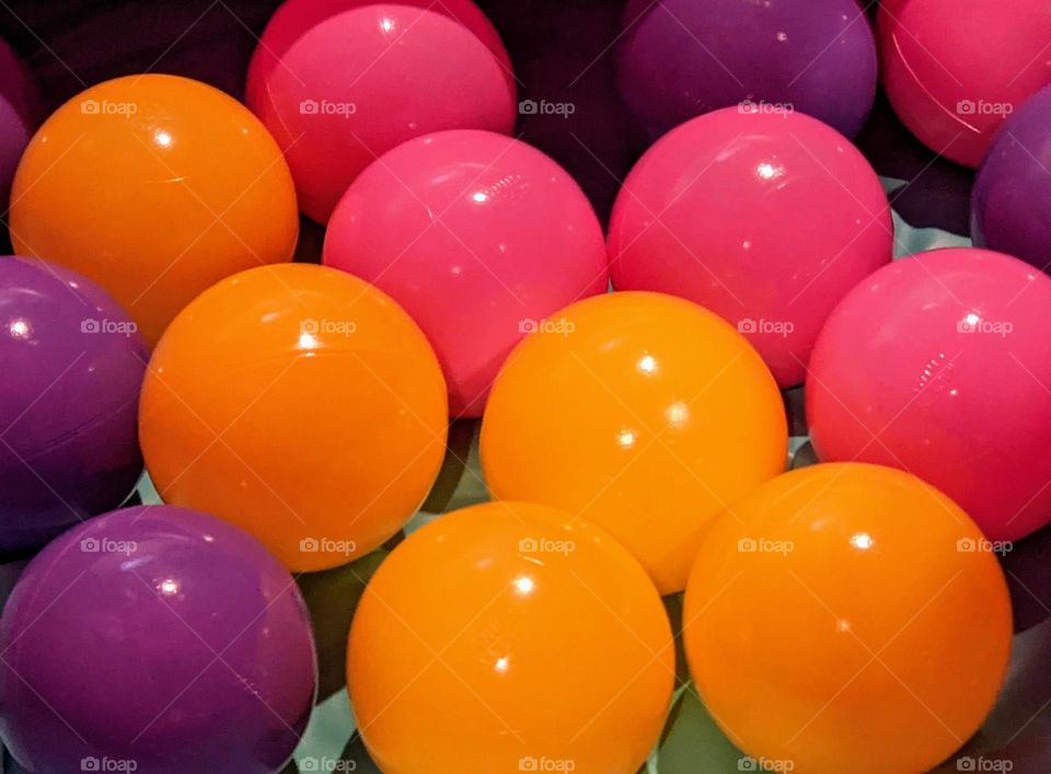 mixed colored balls from a ball pit
