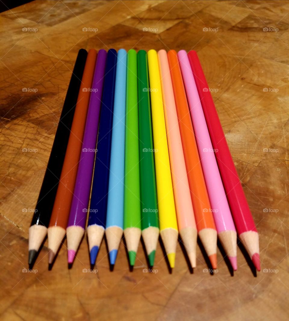 Colored pencils for drawing, coloring, rainbow of colors.