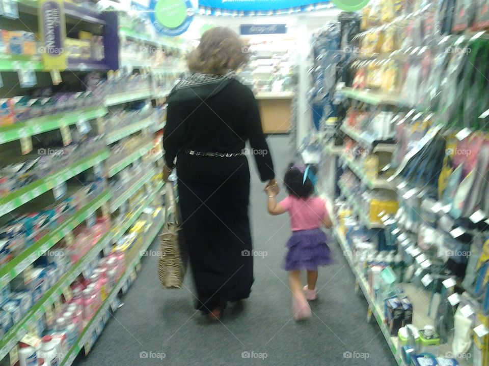 Shopping with Mama Ann. Carmen and her grandmother at the local drugstore