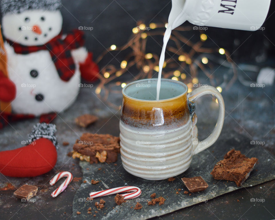 Coffee at winter morning , cozy winters shot , action shot, A cup of coffee for winters lazy day, Festive season , Christmas season