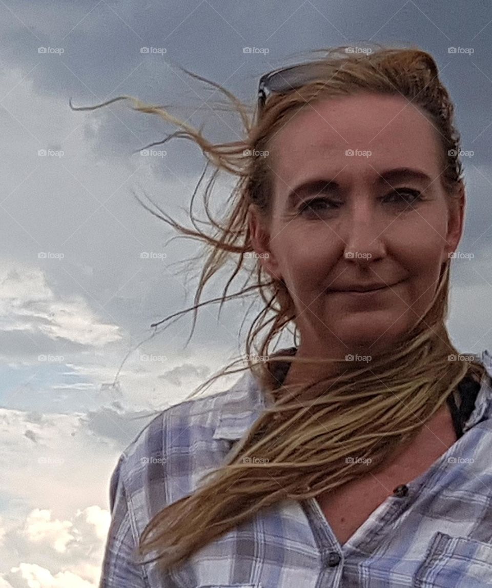 portrait of a woman on a windy day .