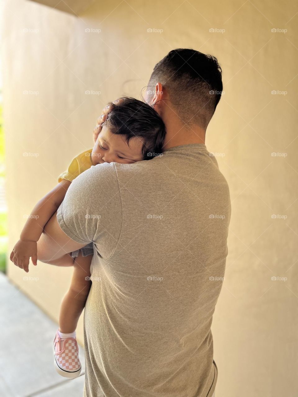 Dad with sleeping child 