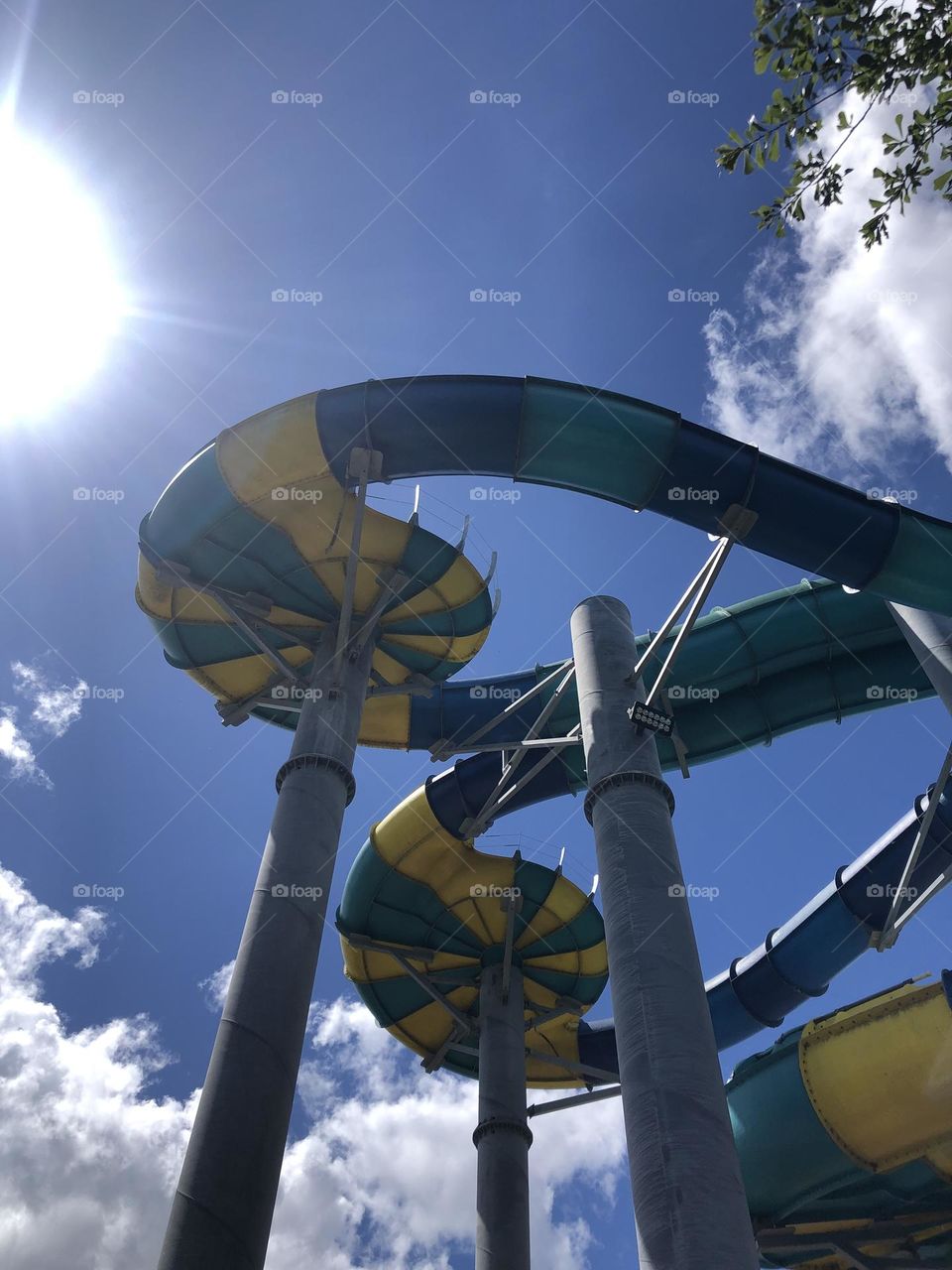 Upshot of slides at a water park here in Texas, against the bluest sky and hottest sun ☀️