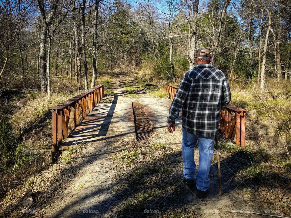 Man Walking in Forest