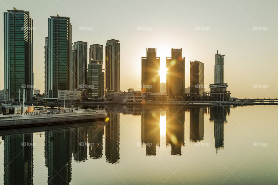 Perfect reflection of the city in the sea. Seeing double.