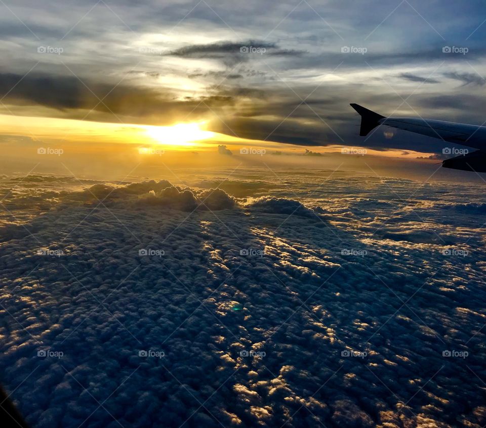 Fly with clouds and enjoy the sunset 