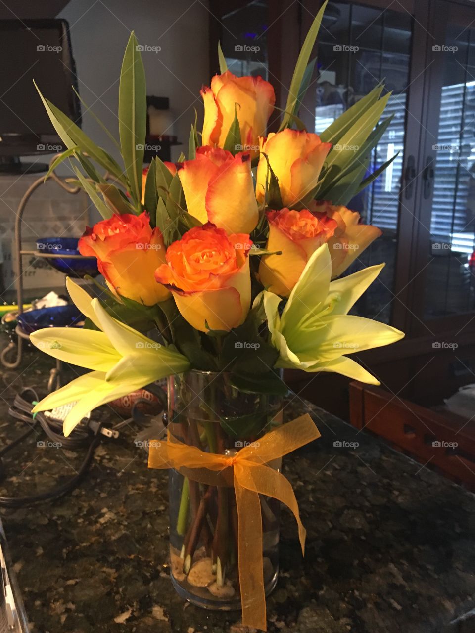 High and magic roses with yellow lilies!