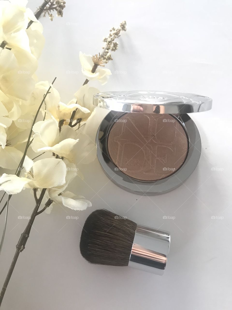 Dior makeup highlighter. Luxury makeup such as dior and yves st Laurent are high end and this photograph extremely well. 