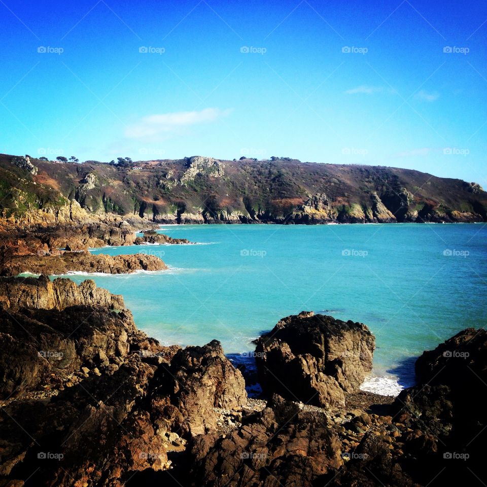 Guernsey, Channel Islands . Hot summers day sitting on the rocks in Guernsey 