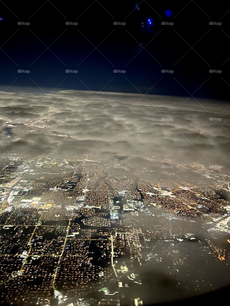 City high view in the night . Lights and clouds 