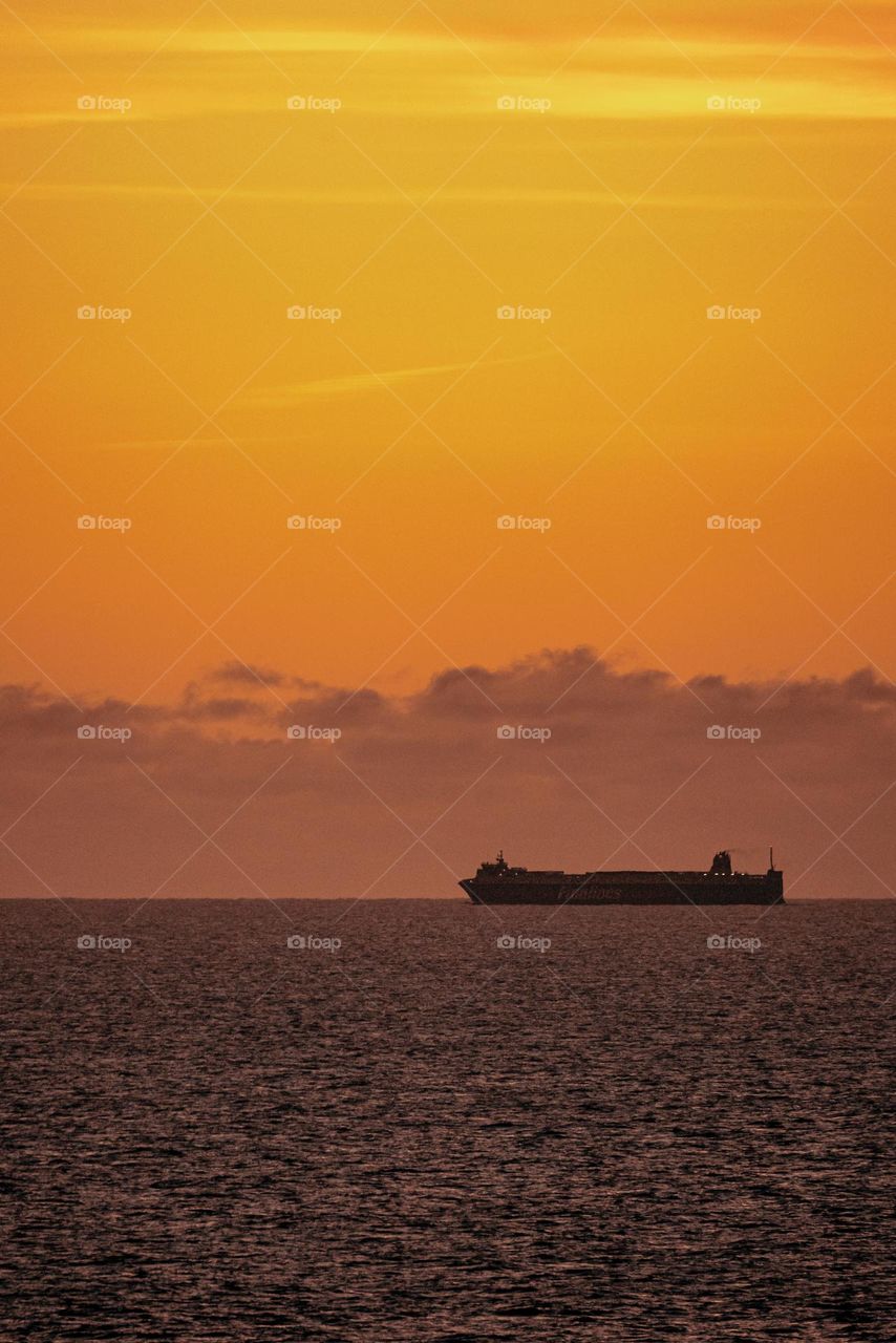 Ferry sails in the Baltic Sea at dawn