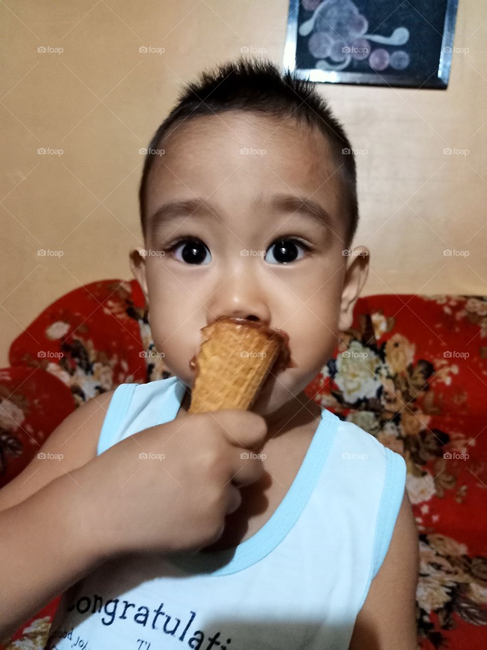 Cutie eating ice cream.