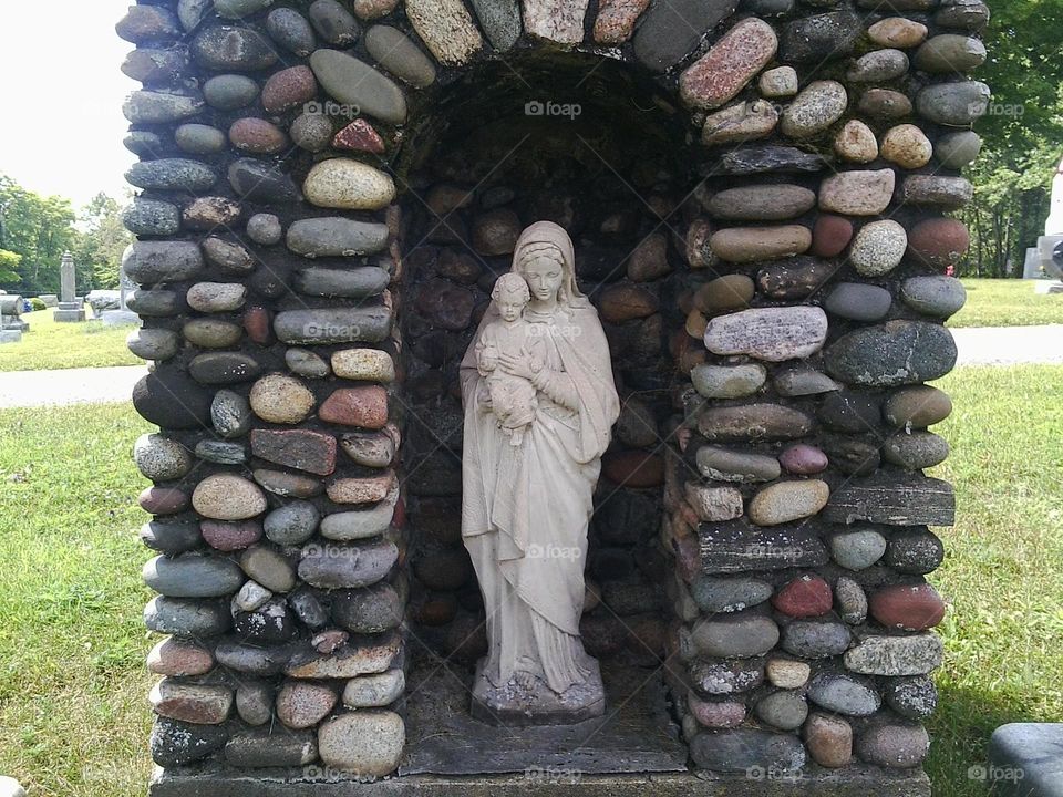 Statues of Mother Mary from a graveyard