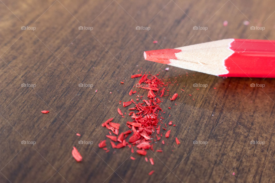 Red colored pencil sharpened crumbs 