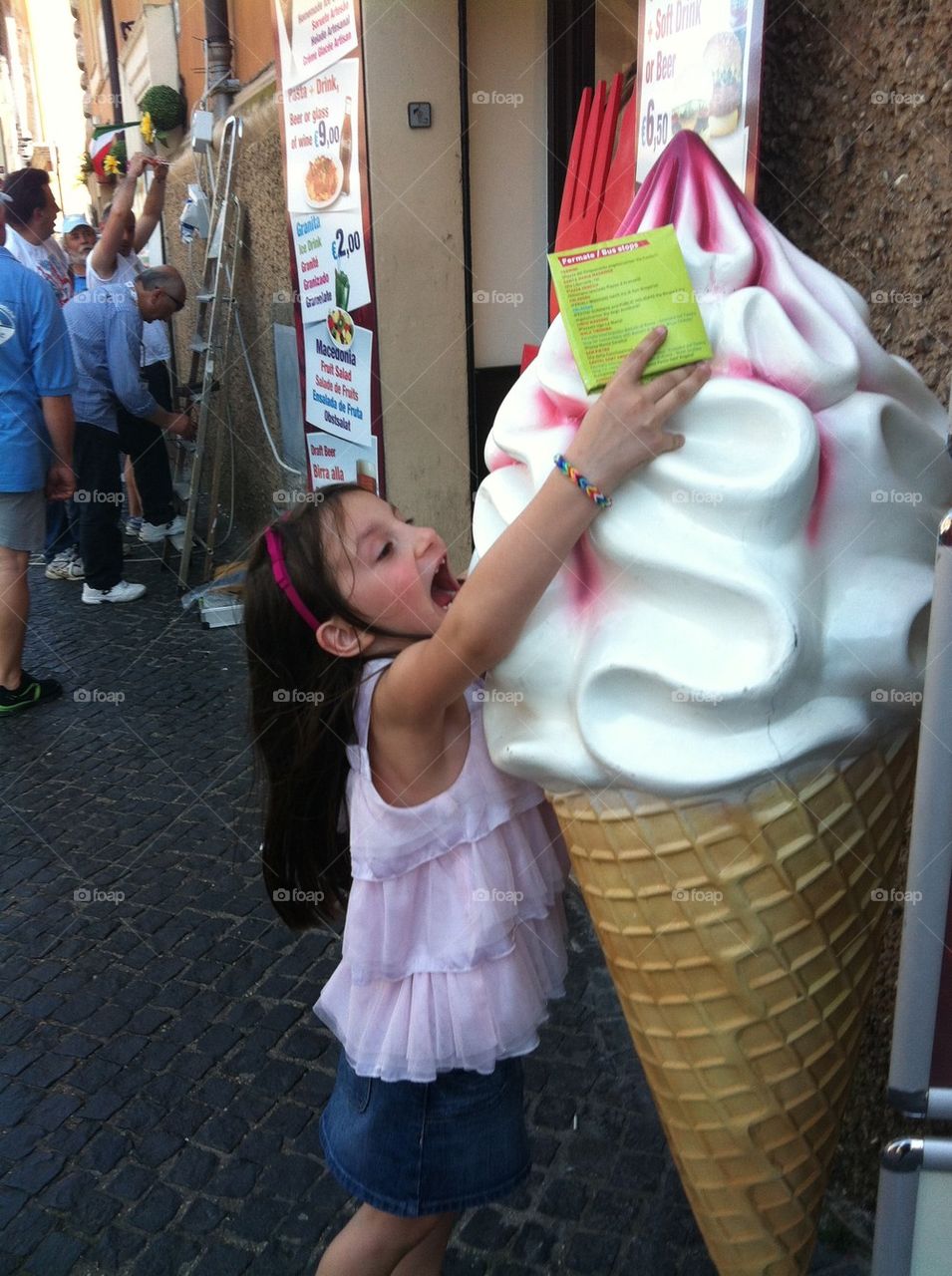 Little girl and big ice cream
