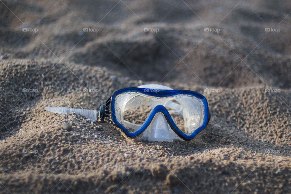 Snorkeling mask on sand