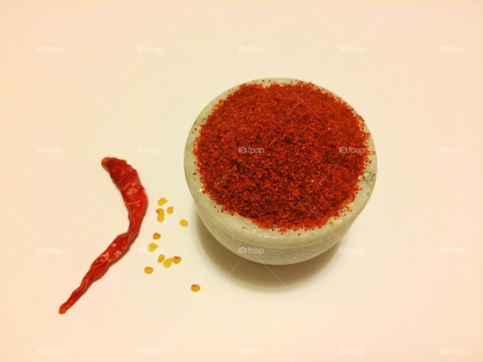 Red chilly powder in pestle