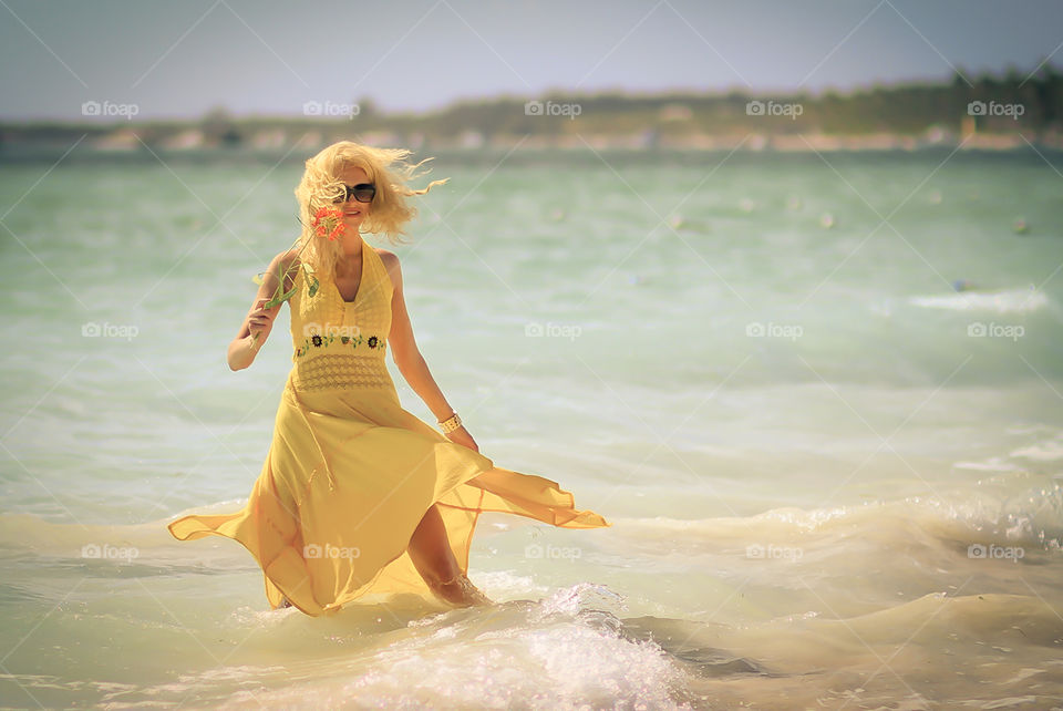 Beautiful Portraits in motion on the beaches of Punta Cana in the Dominican Republic. This model was from the country of Ukraine. Blending the vibrant yellow and pink colors and putting it all in motion set this set of shots apart from many.