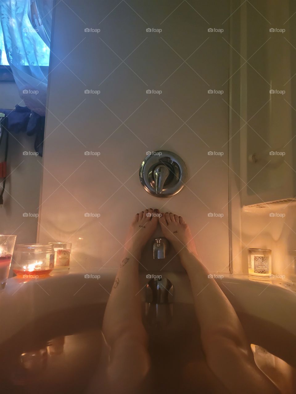 legs in a bath tub