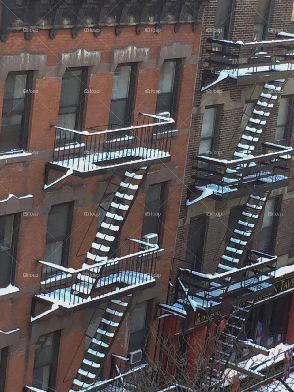 Outside of a New York buildings with snow-covered fire scapes