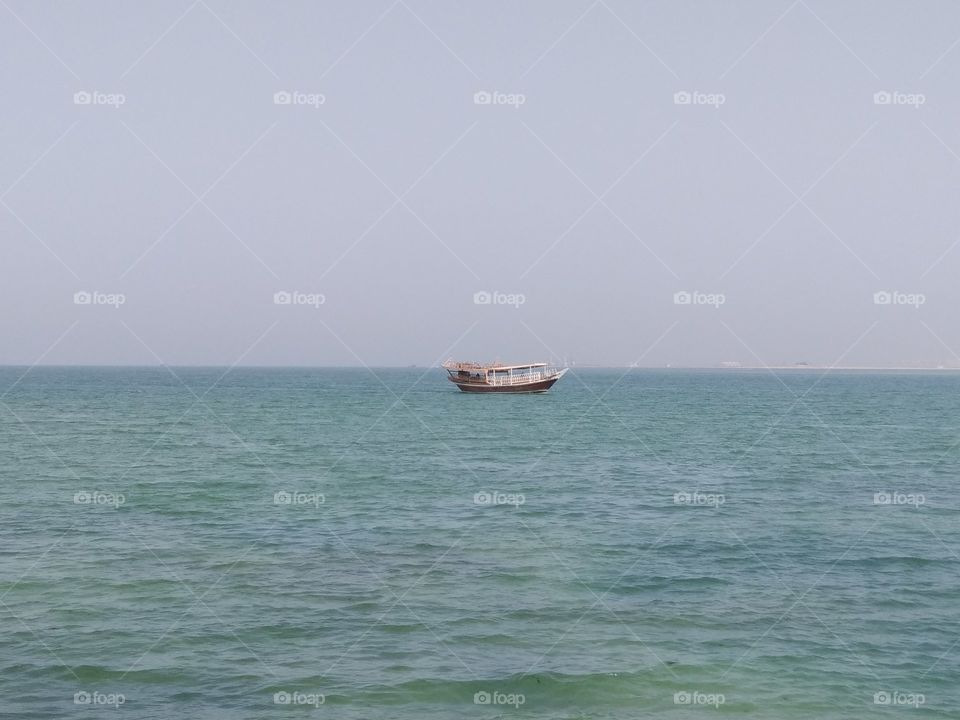 Floating boat on ocean