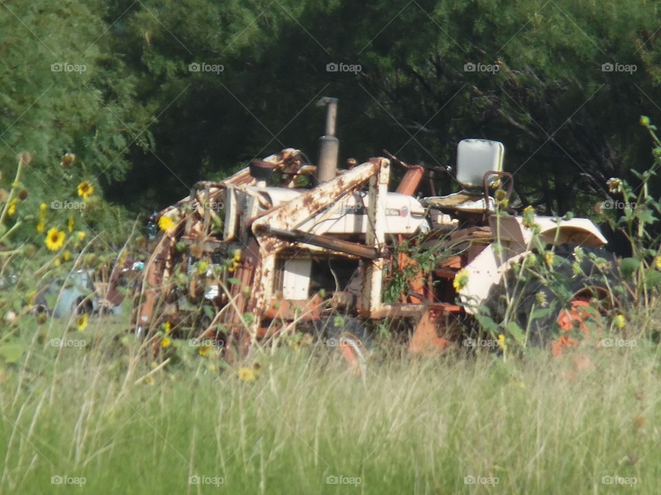 tator tractor 🚜. This is a picture of a old tractor 🚜 that I saw sitting in a field near Eliasville Texas. 👣 🚶 🏃 🔥 💨