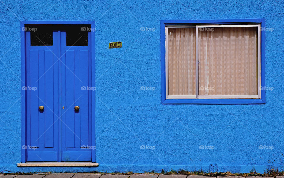 A colorful blue house in Puenta Arenas, Chile, South America 