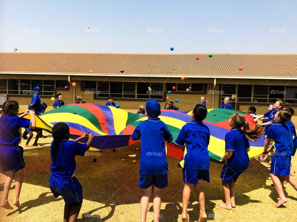 Clash of colours. How colourful is this parachute, motivating one to want to play with the colourful balls