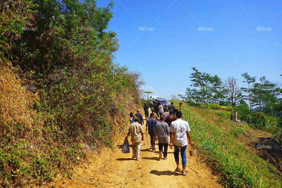 people walk on the funeral procession