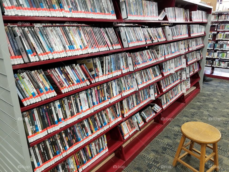 library displays its vast amount of dvds, shelves in the library