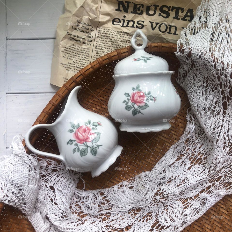 Old porcelain set sugar bowl and creamer with cozy roses pattern