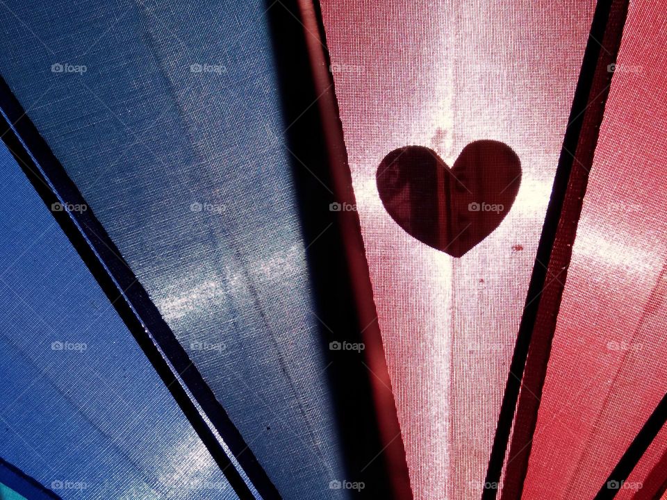 love sign against the light on colorful background