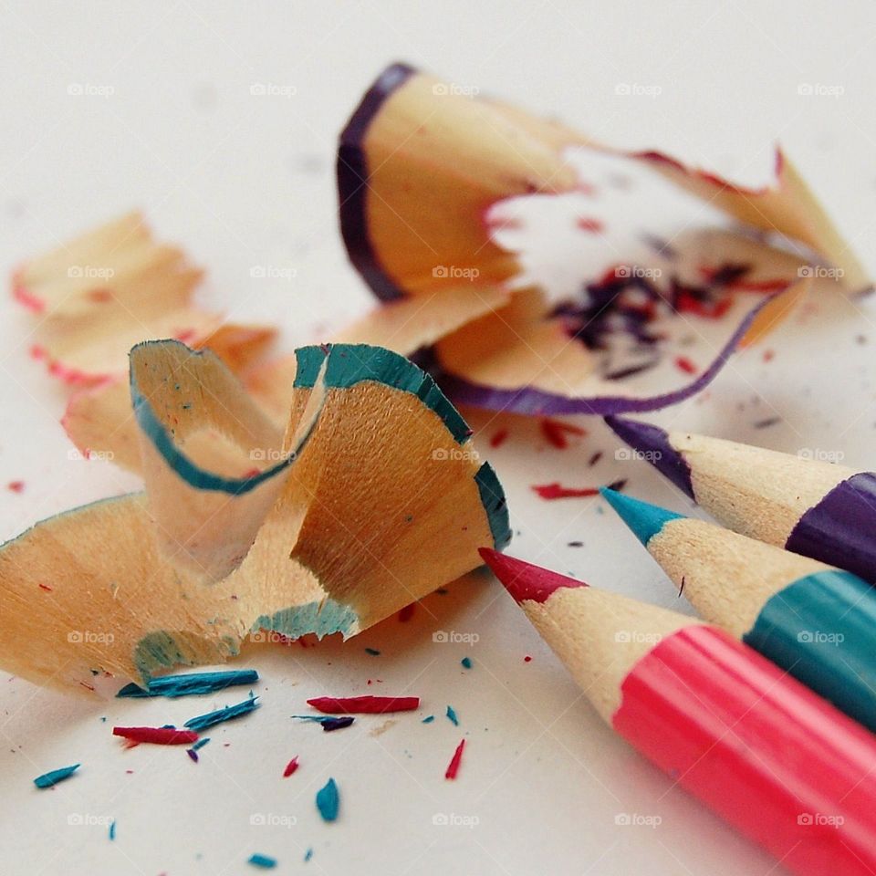 Coloured crayons and sharpenings