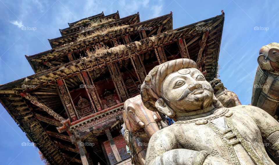 A holy temple and the statue situated in Bhaktapur of Nepal. Beautiful architecture made in ancients time..