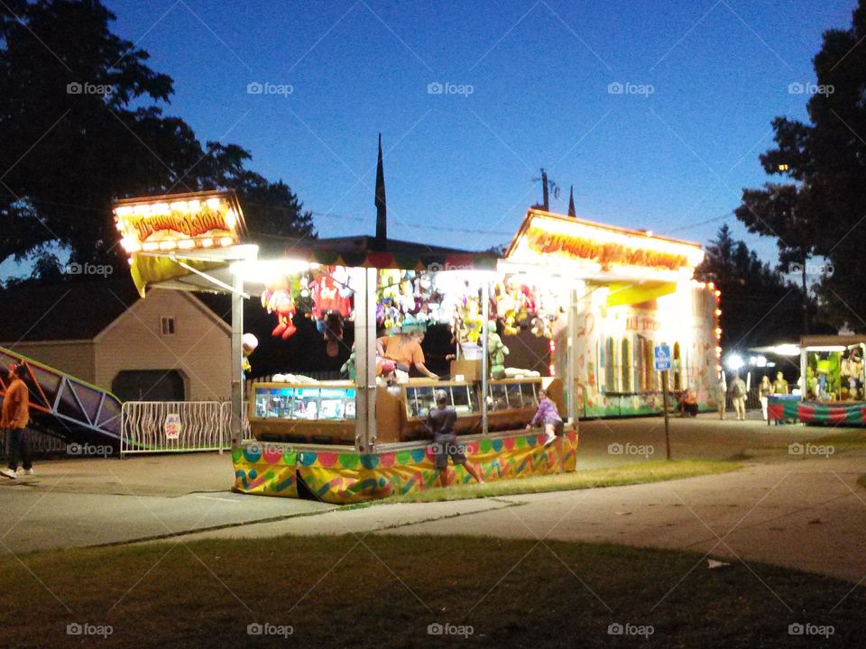 Summer Fair at Sunset. Carnival games as the sun is beginning to set.
