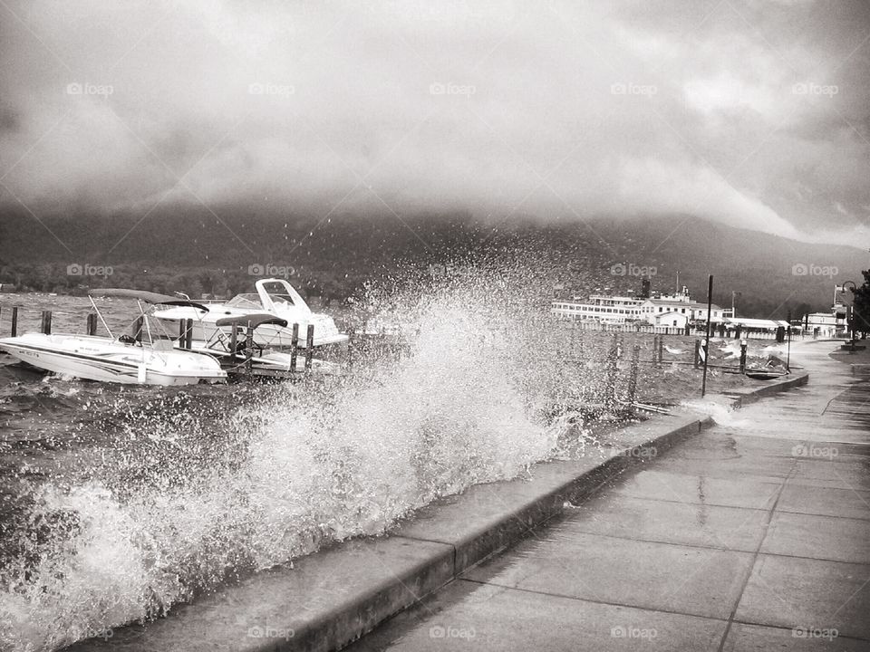 A strong thunderstorm causing crashing waves near a marina at Lake George Village, NY. 