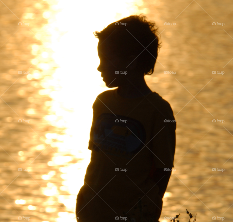 sunset lake boy silhouette by lightanddrawing