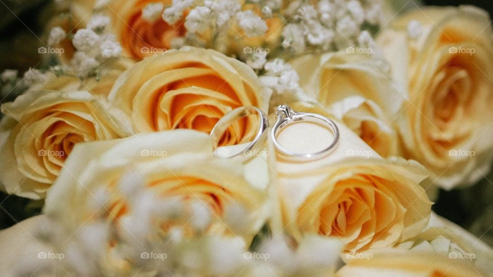 wedding ring in the middle of a rose.