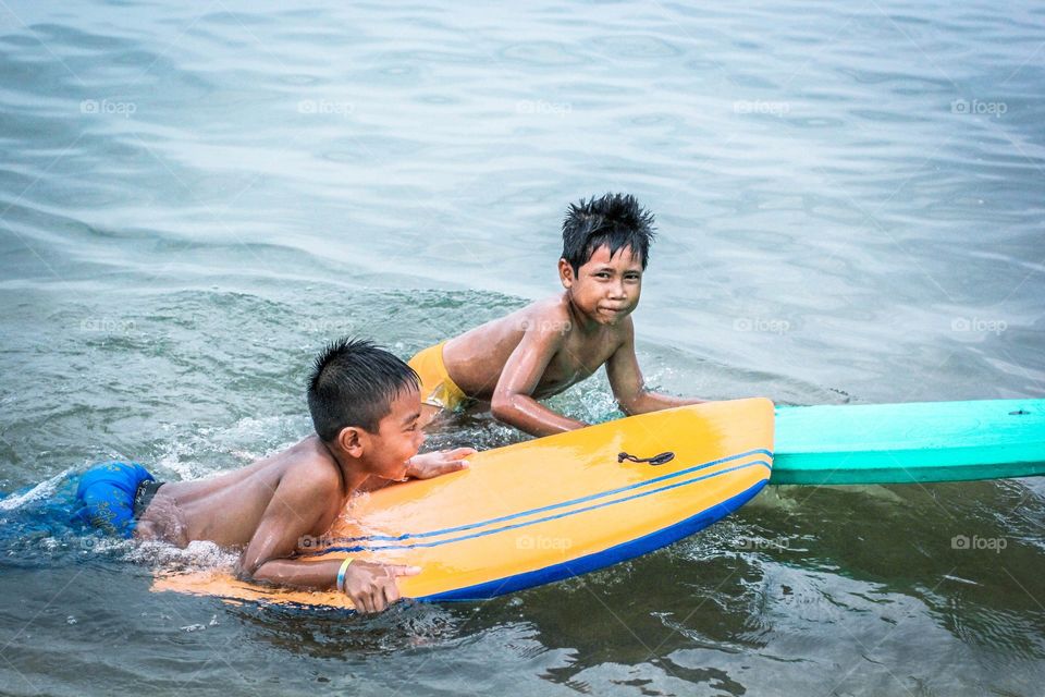 Local balinese kids playing in the water
