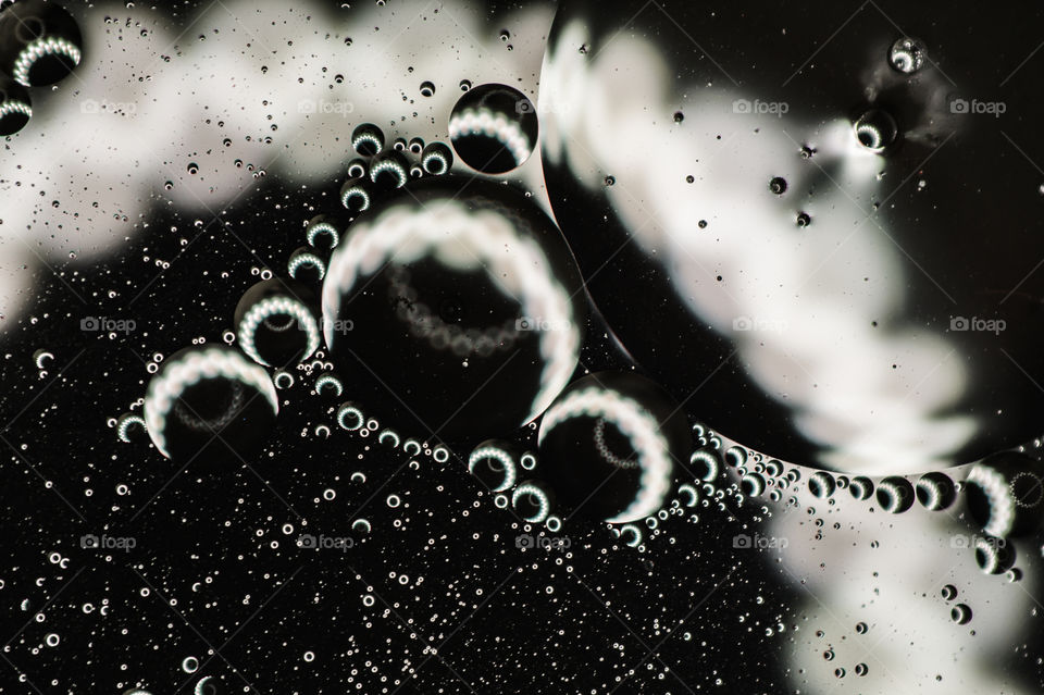 Vegetable oil bubbles on black background