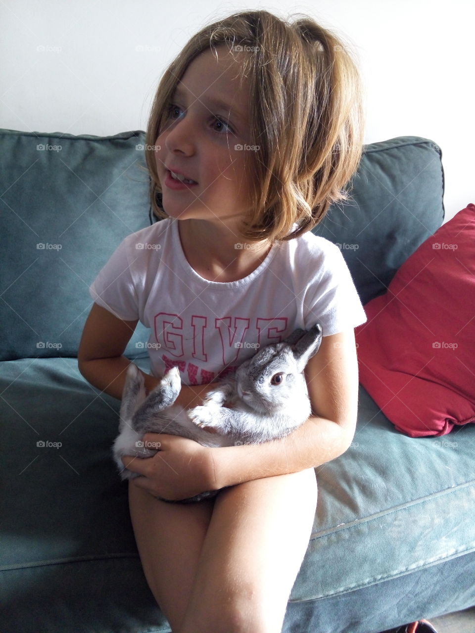 My daughter with our rabbit