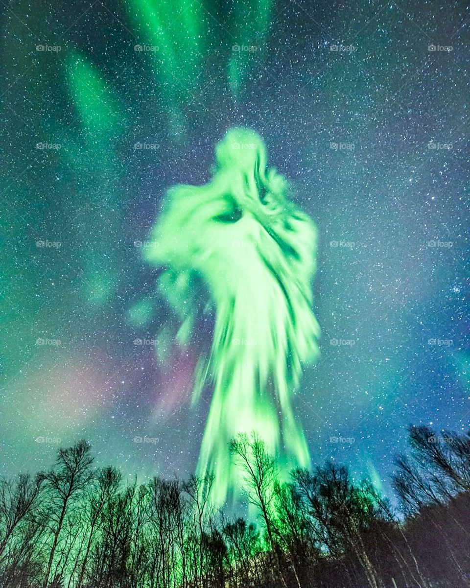Multicoloured green, blue, violet vibrant aurora borealis Polaris, colourful northern lights in night sky. Norway, Iceland. 