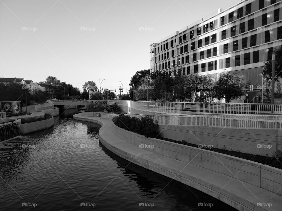 Architecture in black and white.  River and buildings.