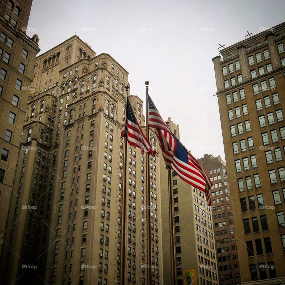 Tall buildings  and  American flag 