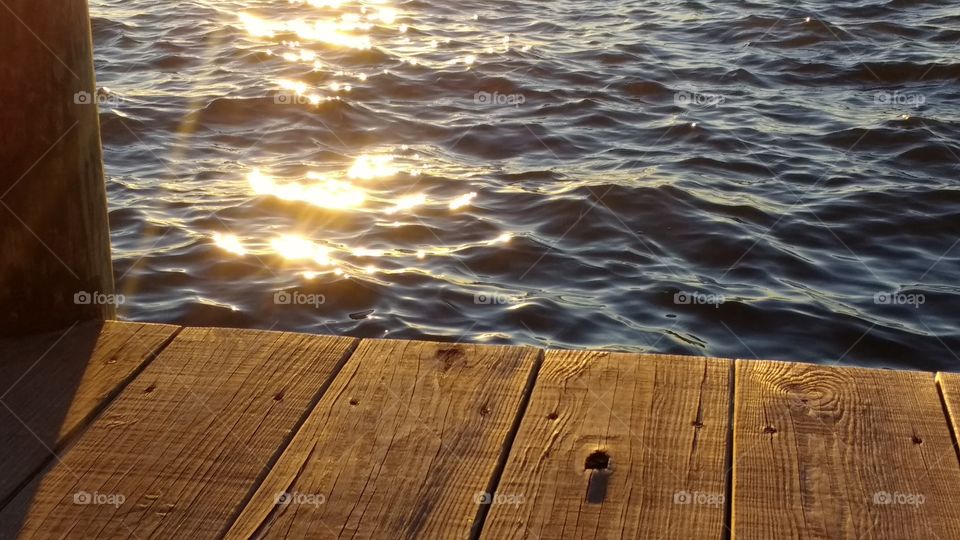dock over water close up at sunset
