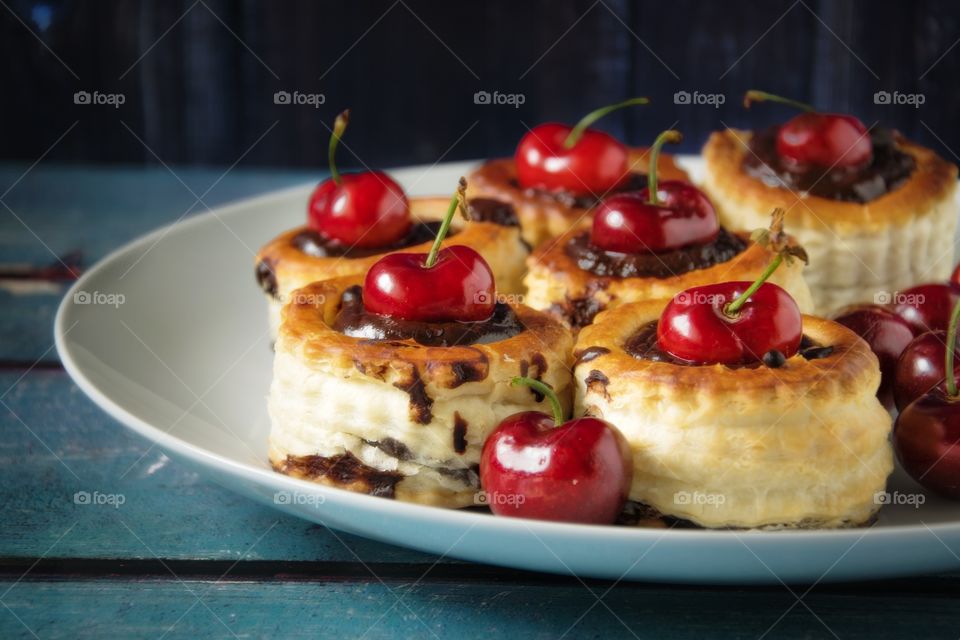 Cupcake with cherry on plate