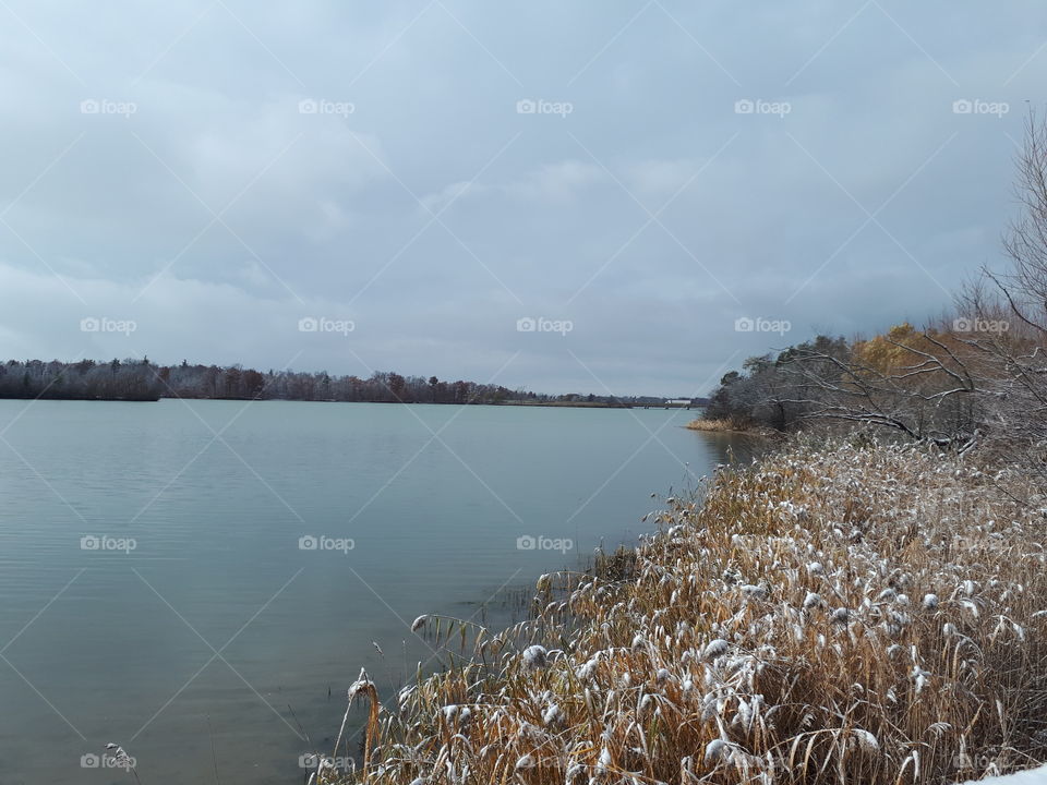 winter begins along a placid river