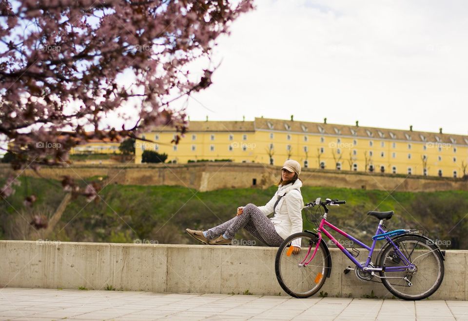 woman enjoying the view accross the river after a bike ride